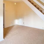 Open plan lounge and diner with beige carpet in 2 bed property for rent Milton Keynes