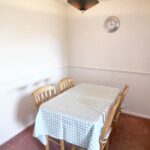 Dining area with table and four chairs in Milton Keynes rental property